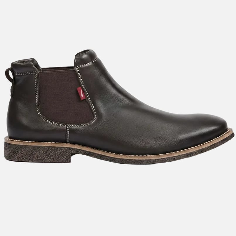 A dark brown leather Chelsea boot with a brown elastic side panel and a small red leather brand tab, shown in a side profile on a white background.