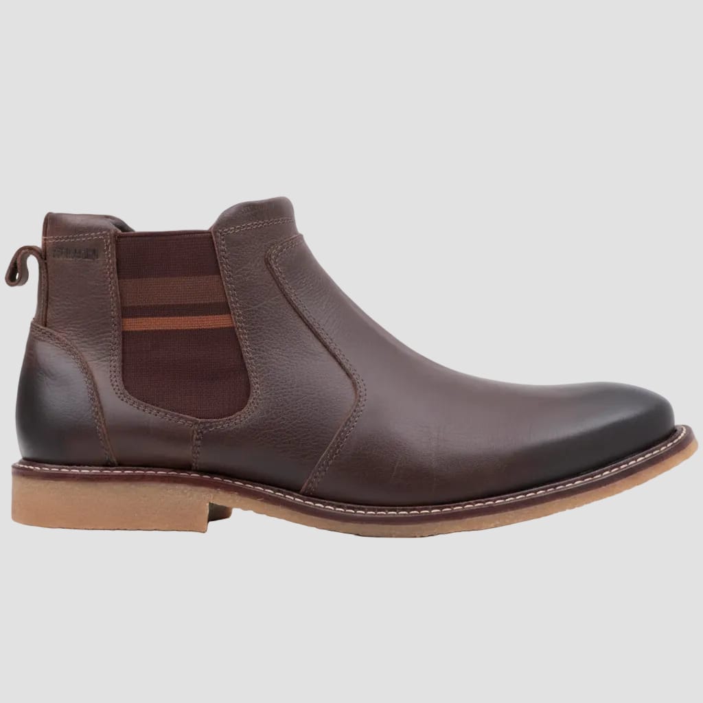 Brown leather Chelsea boot on a white background
