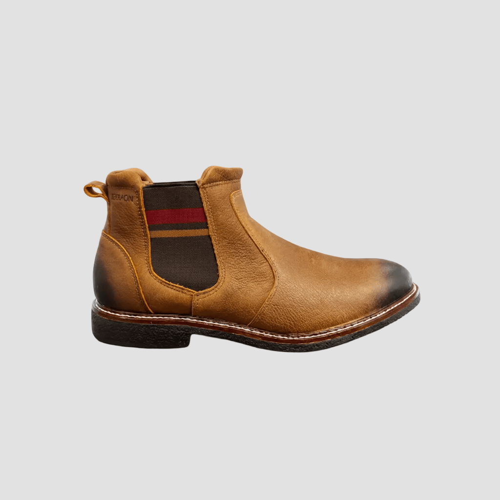 Brown leather Chelsea boot with a red stripe on a white background