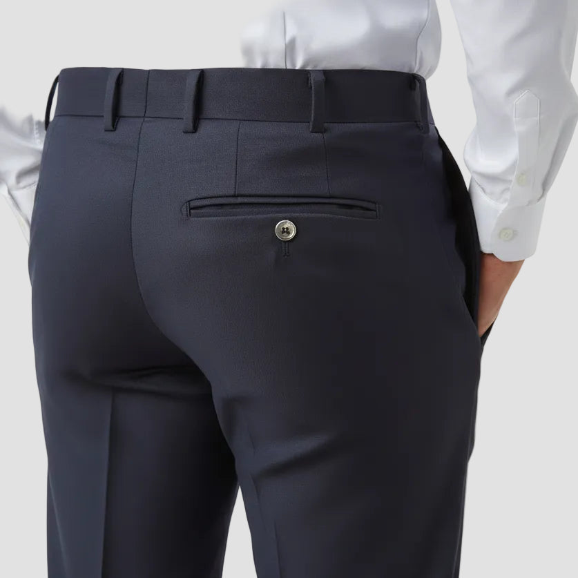 Close-up of dark navy pants with a button and belt, featuring a white shirt.