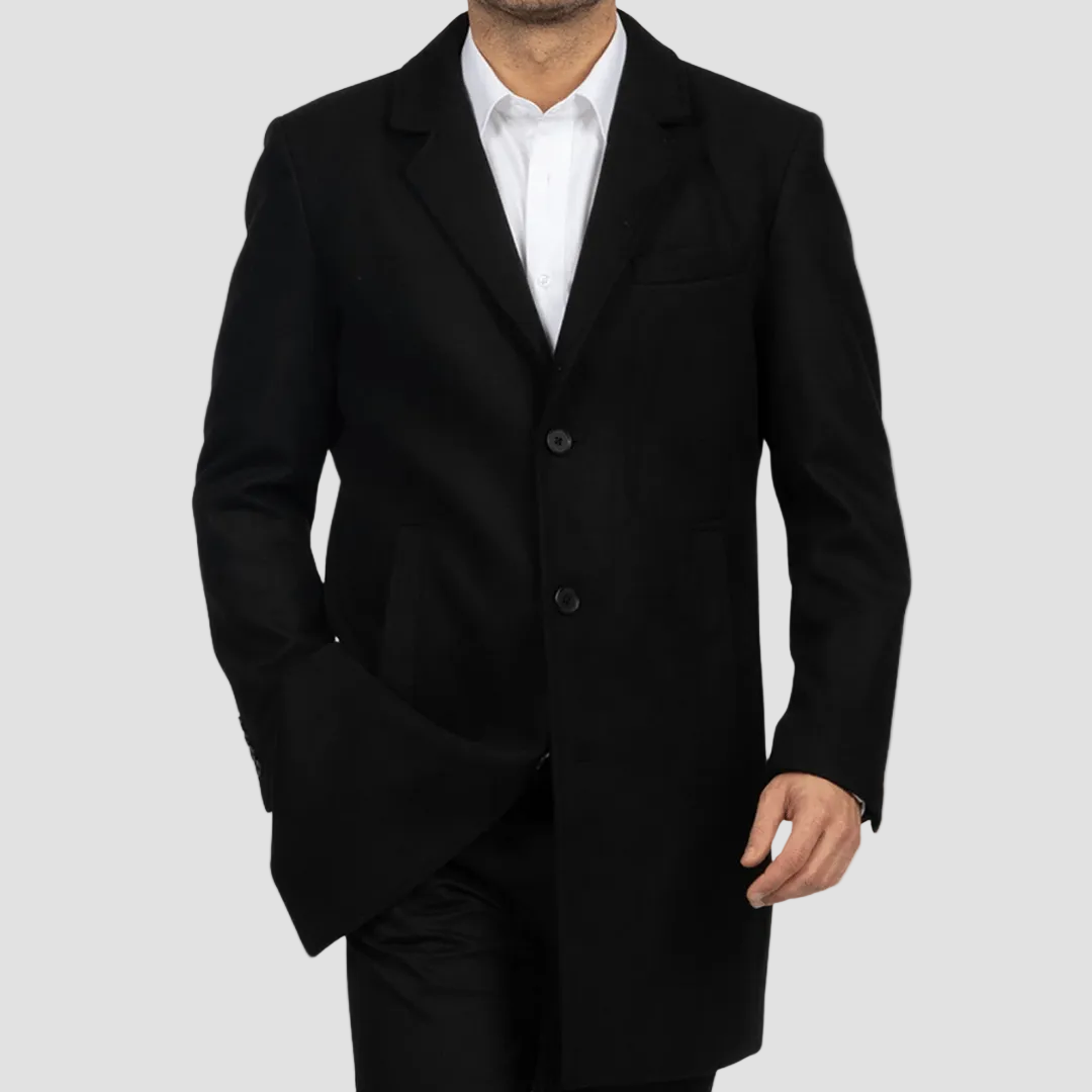 Black overcoat worn by a person on a light gray background
