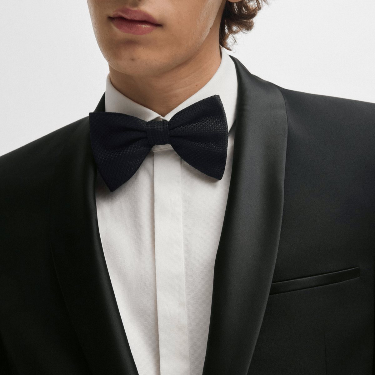 The Arti‑Getlin black tuxedo by Hugo—super slim fit, satin trims, and shawl lapel.