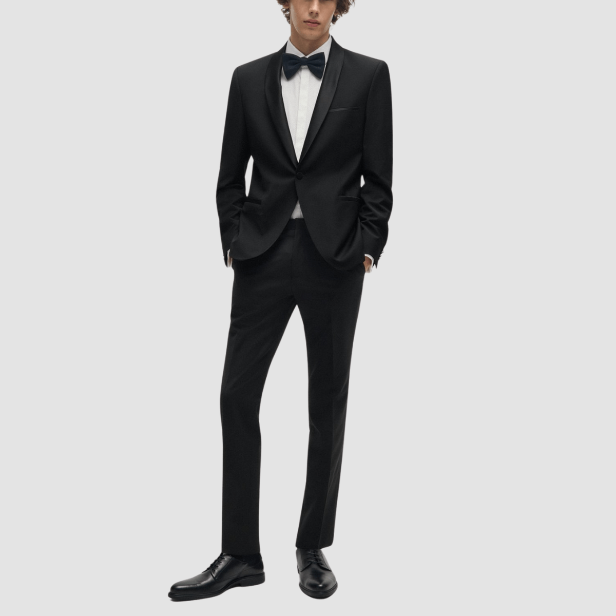 The Arti‑Getlin black tuxedo by Hugo—super slim fit, satin trims, and shawl lapel.