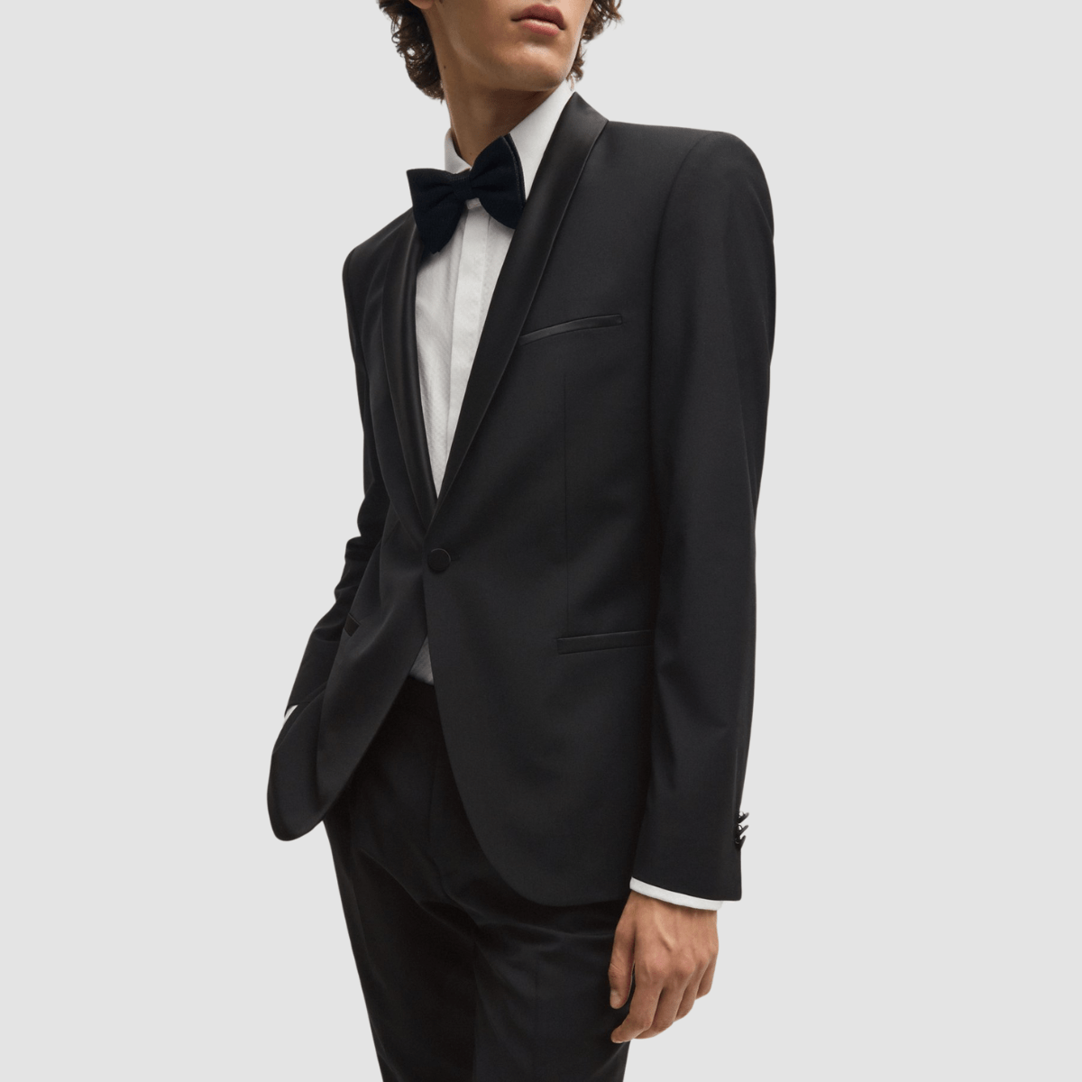 The Arti‑Getlin black tuxedo by Hugo—super slim fit, satin trims, and shawl lapel.