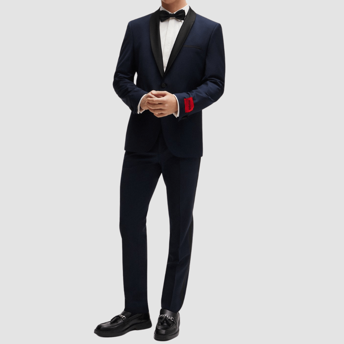 The Arti‑Getlin dark blue tuxedo by Hugo—super slim fit with black satin trims and shawl lapel.