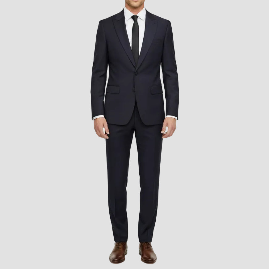 Slim fit Penn peak suit in navy wool stretch by Jenson.