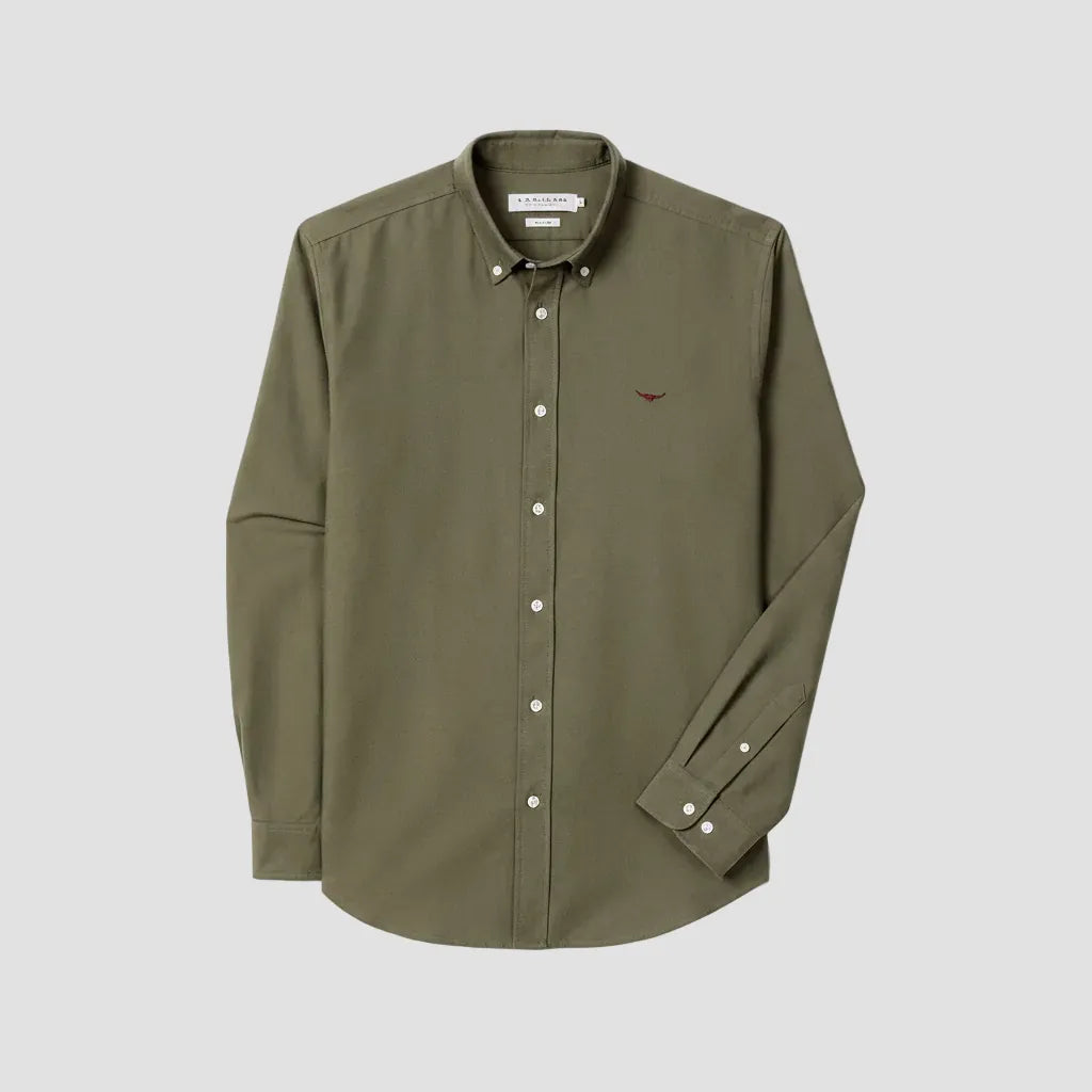 Green button-up shirt with a small logo on a white background
