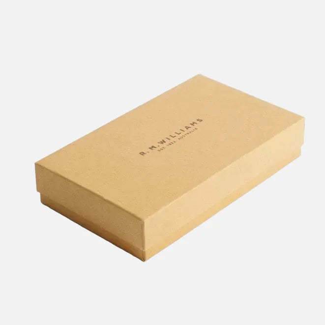 A rectangular brown kraft paper gift box with a lid, featuring the brand name 'B. MILLIARS' printed in black on the top surface, set against a plain white background.