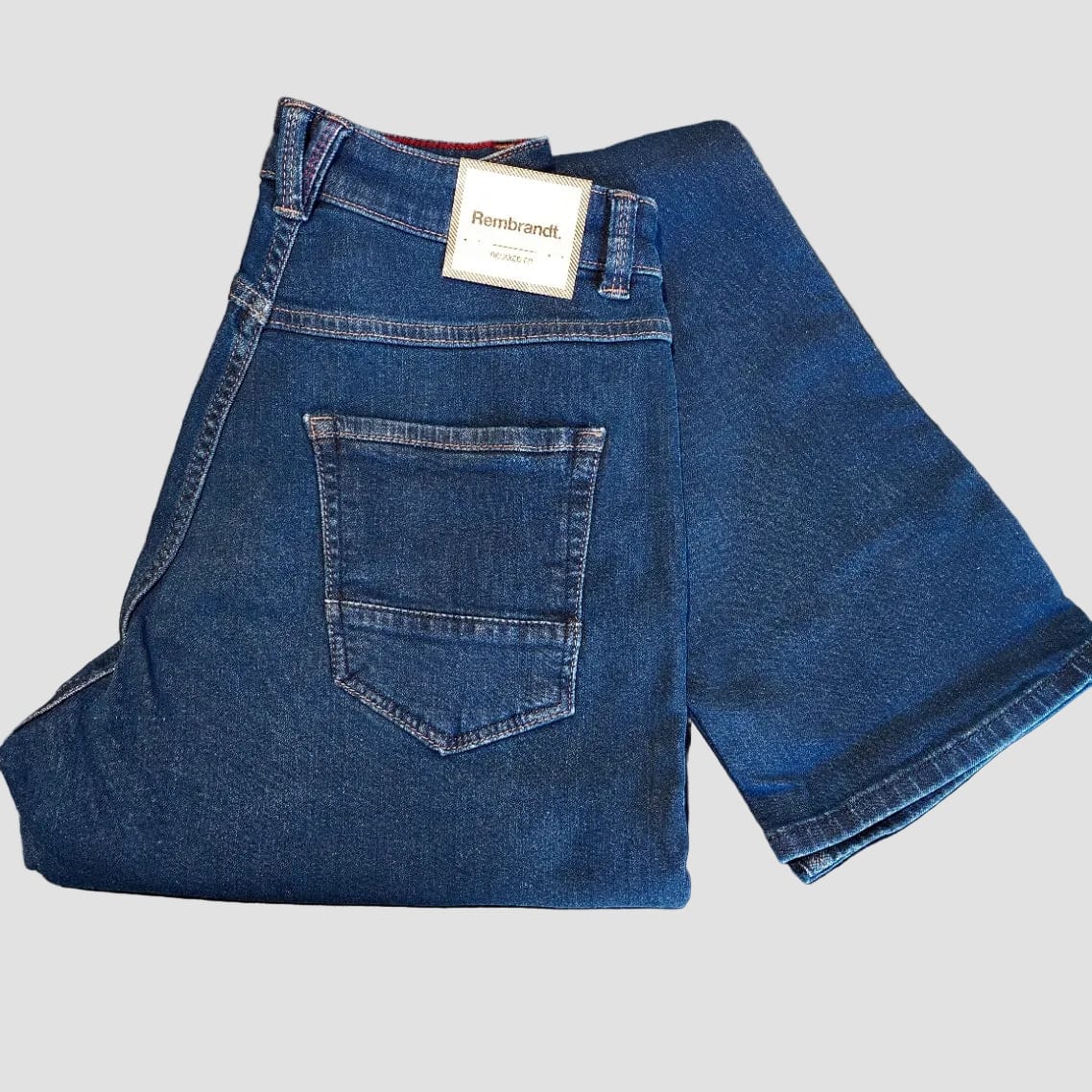 Men’s Austin Jean in mid‑blue washed stretch denim, offering a relaxed tapered fit with natural fading and all‑day comfort.