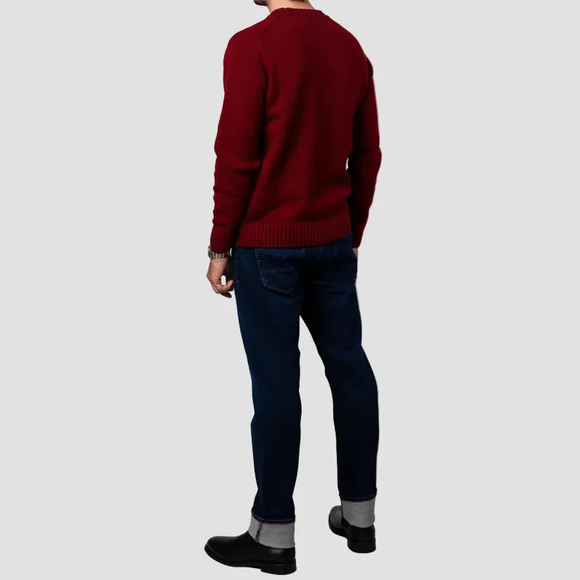 Men’s Austin Jean in mid‑blue washed stretch denim, offering a relaxed tapered fit with natural fading and all‑day comfort.