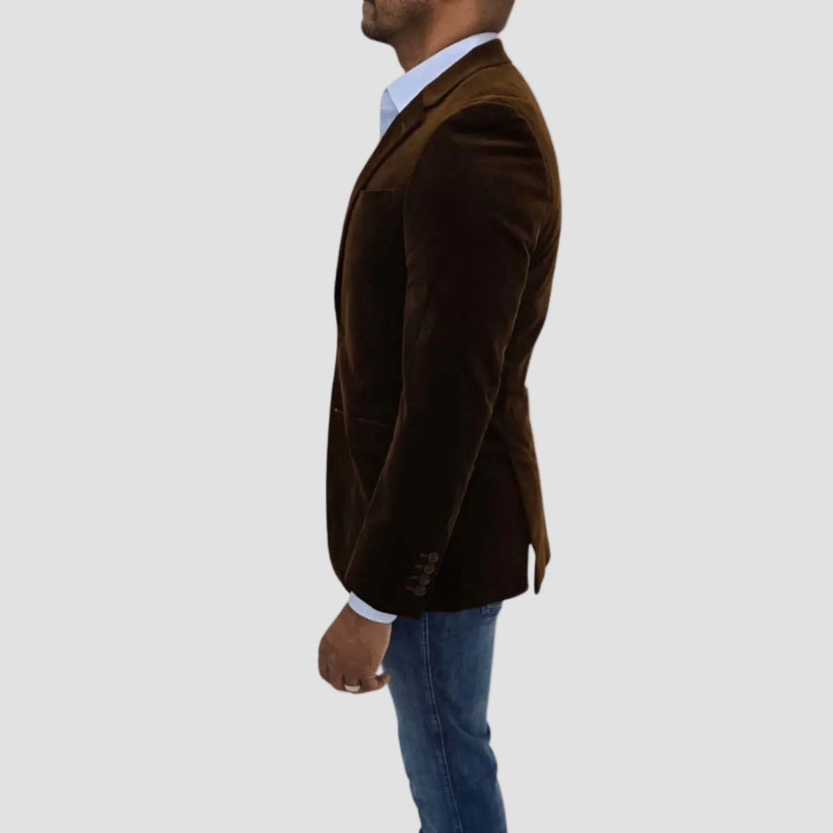 A man wearing a camel-colored, tailored-fit, cotton corduroy sports jacket by Savile Row, with a notch lapel, two-button closure, and flap pockets, over a light blue shirt. Limited stock.