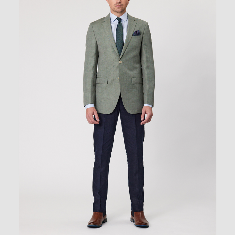 The Savile Row Slim Fit Abram Sports Jacket in Green Linen Blend paired with navy trousers