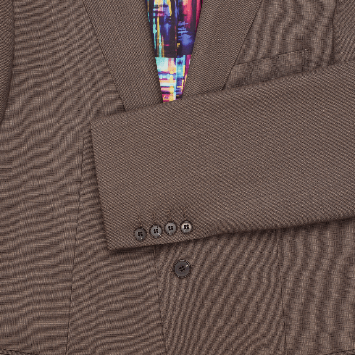 A latte brown wool suit with a tailored fit, by Savile Row, sleeve with four buttons.