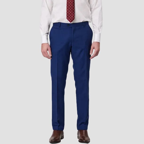 Person wearing demin-blue dress pants by Savile Row with a white shirt and brown shoes