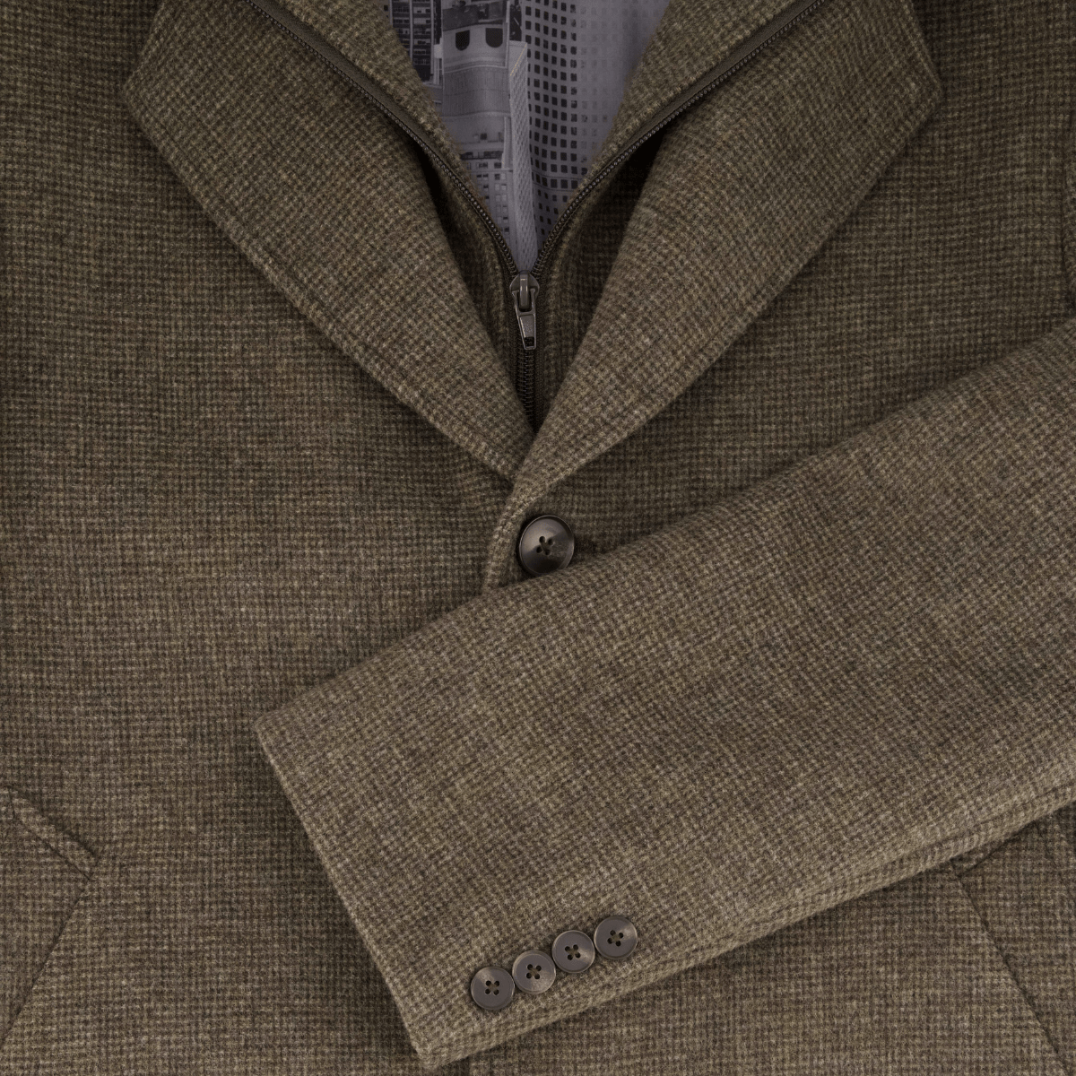 Close up of a brown wool cashmere blend men's coat by Savile Row, featuring a classic design with buttoned sleeves and a button front.