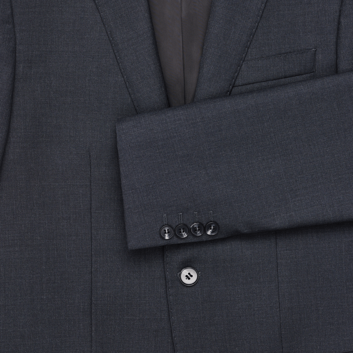 Close up of charcoal wool blend suit by Savile Row, showing cuffs, buttons and fabric.