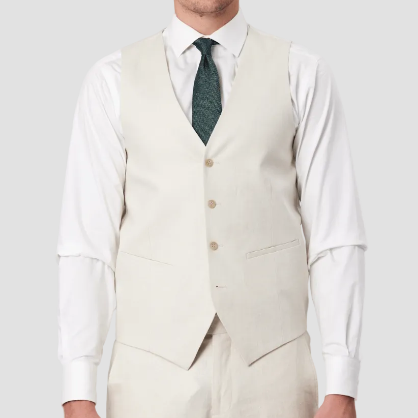 Pure Linen four buttoned vest in Ecru by Savile Row paired with matching trousers, white shirt and green patterned tie.
