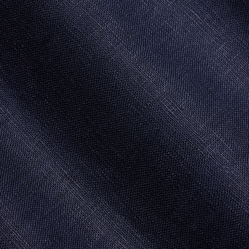 Closer look at the linen fabric of the Savile Row suit in navy blue.