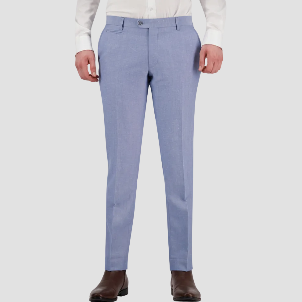 A man wearing a sky blue tailored fit suit trouser by Savile Row, paired with a white shirt and brown shoes.