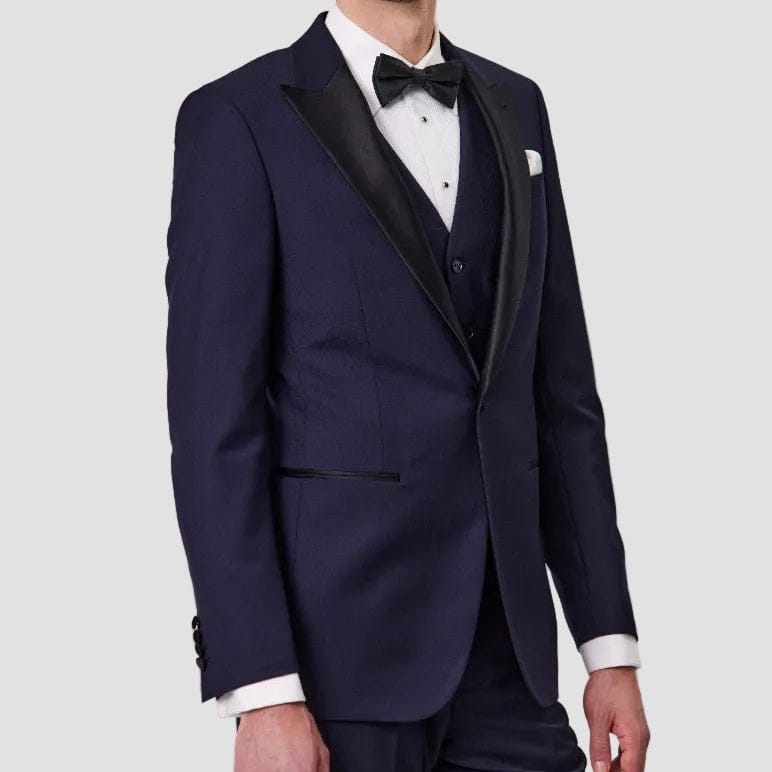 Navy Australian merino wool suit by Savile Row with a white shirt, black bow tie and white pocket square.