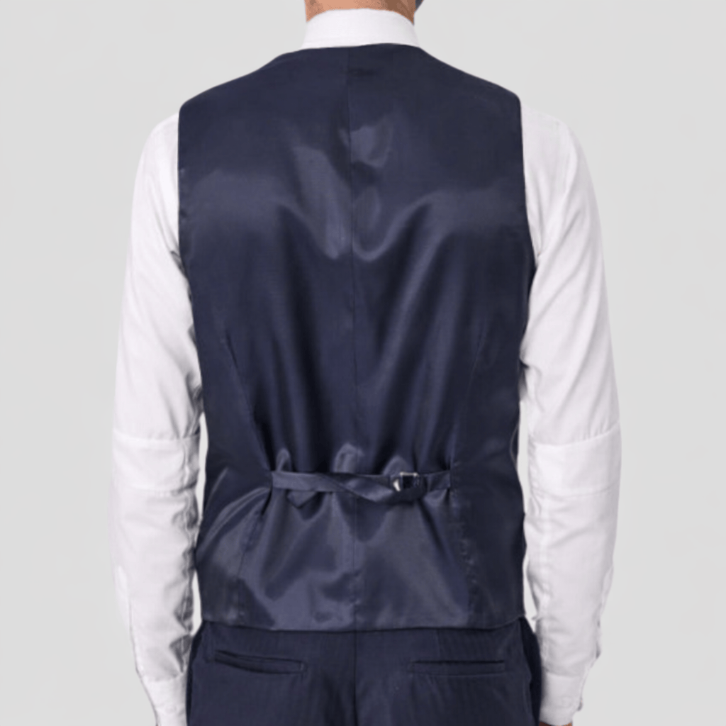 Navy blue Tasmanian wool vest with Satin back and adjustable tab by Savile Row worn over a white shirt.