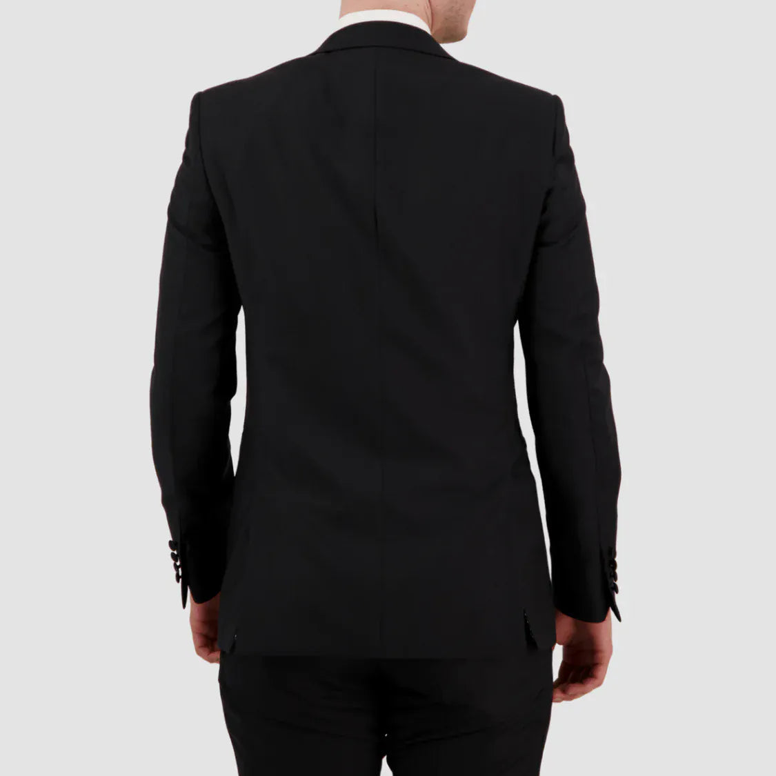 Black suit jacket worn by a person on a white background