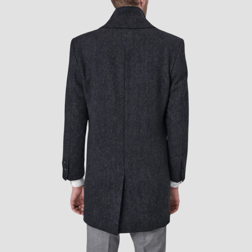 An ash navy removable collar coat with single vent at back by Savile Row.