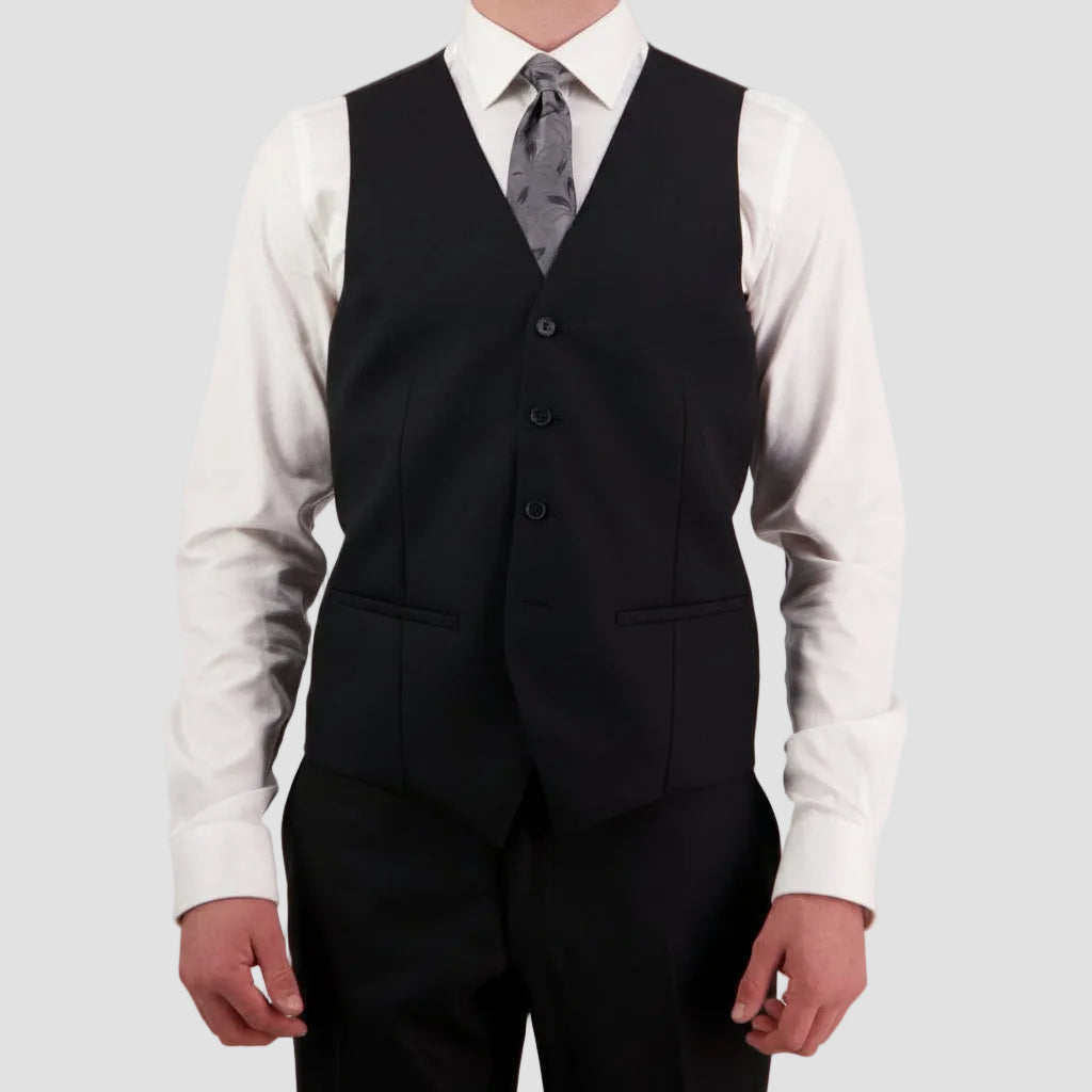 Black vest by Savile Row over a white shirt with a patterned tie
