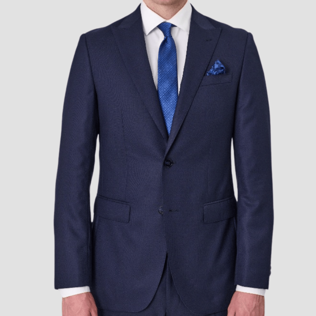 Navy suit by Savile Row with blue tie and pocket square