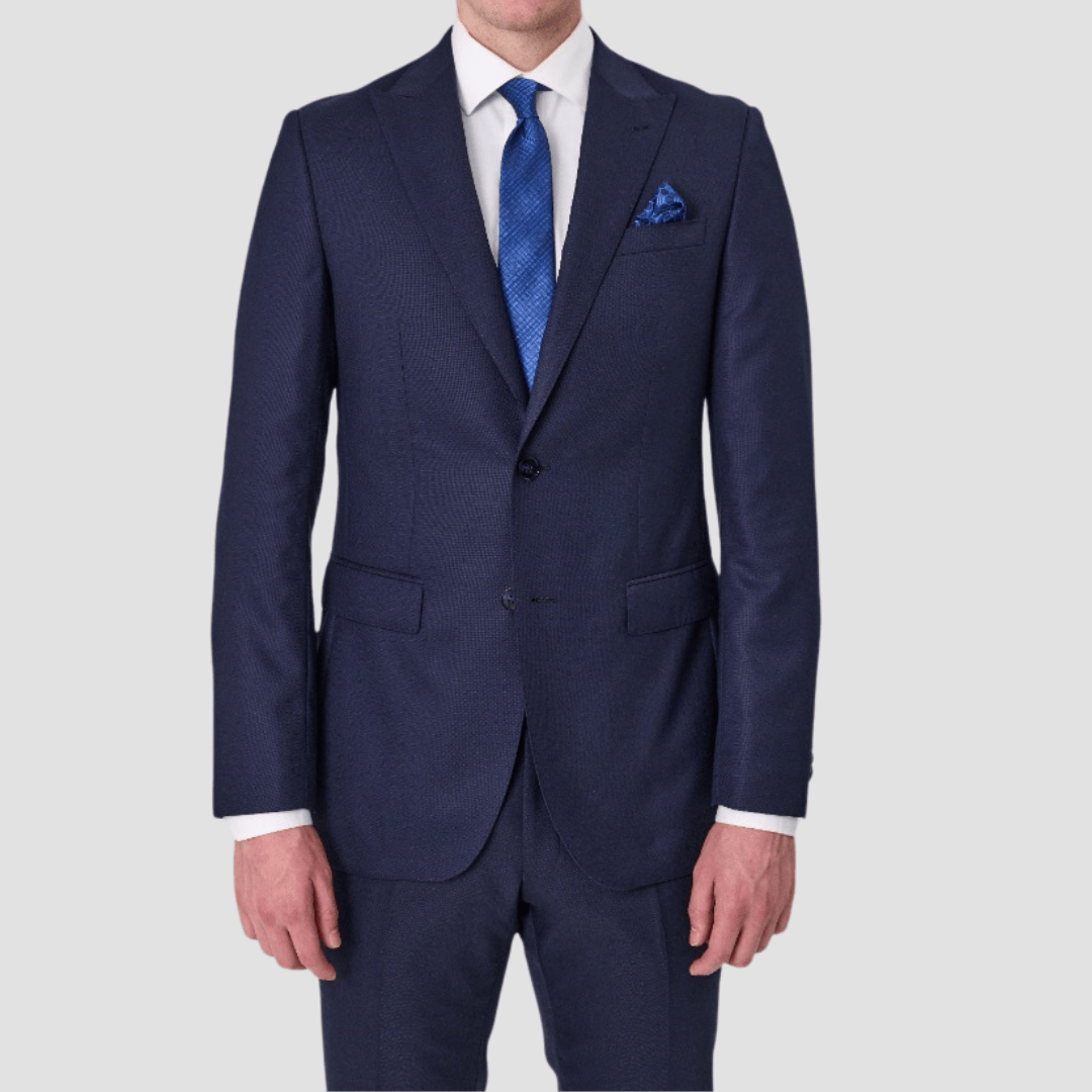 Navy suit by Savile Row with blue tie and pocket square