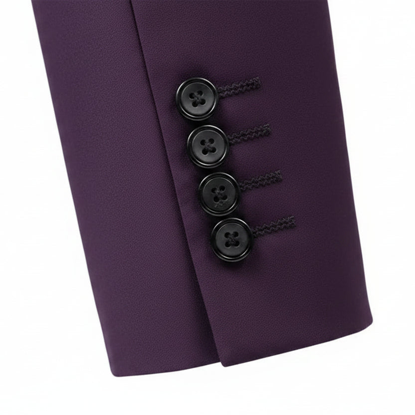 Close-up of a tailored jacket sleeve in purple, showing four black buttons with decorative red stitching and a clean white background.