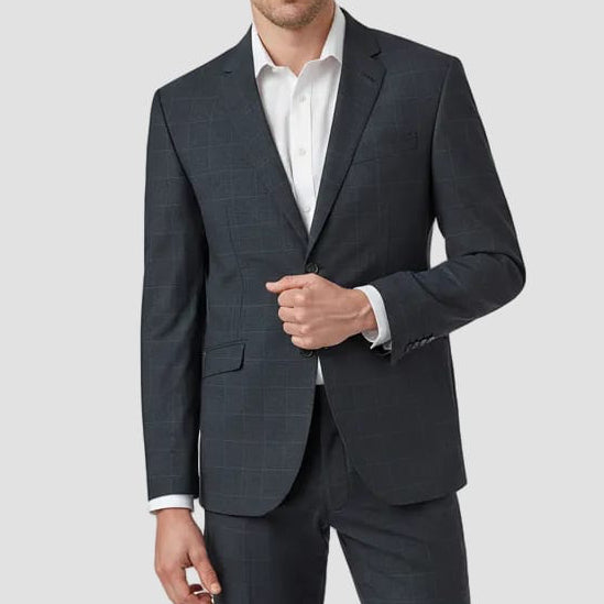 Man wearing a navy check suit with a white shirt 