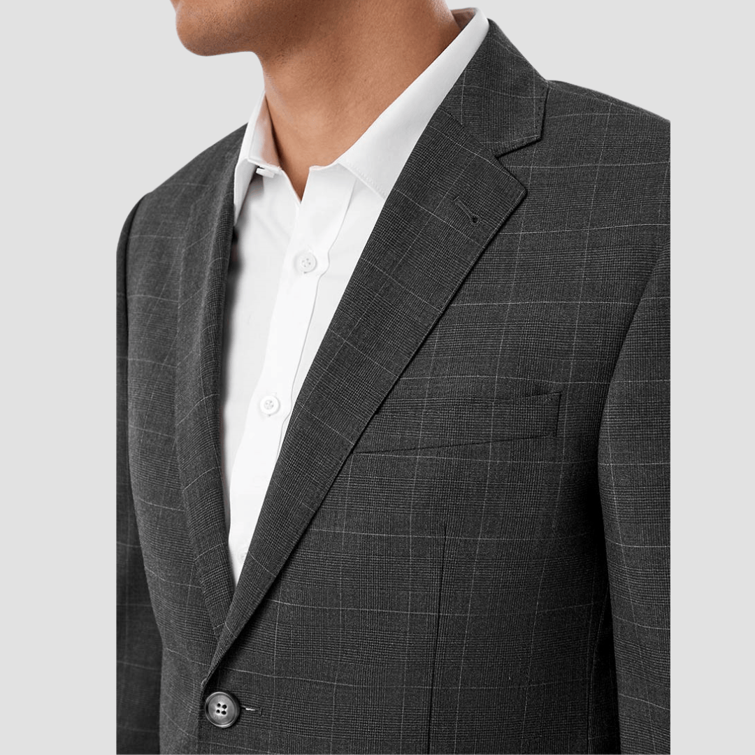Gray checkered suit jacket over a white shirt on a light gray background