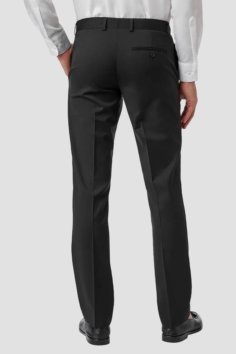 Black dress pants worn by a person on a white background