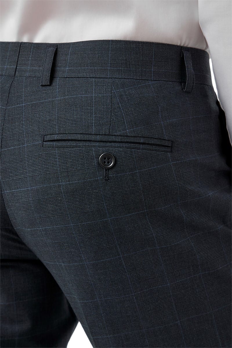 Close-up of navy checkered pants with a button 