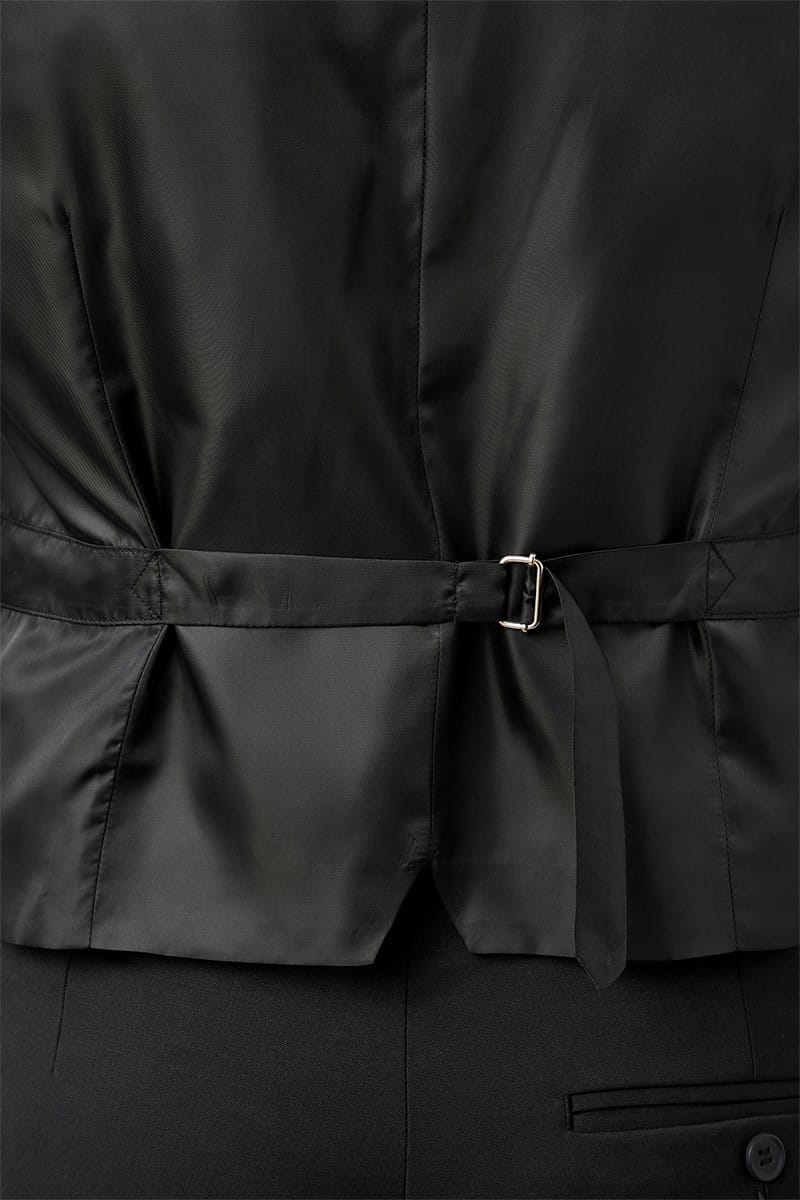 Close-up of a black coat with a belt and button details.
