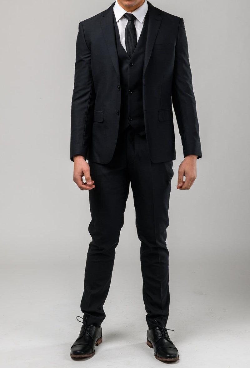 a full length view of a model wearing the Aston slim fit moores suit in black A019301S-NL