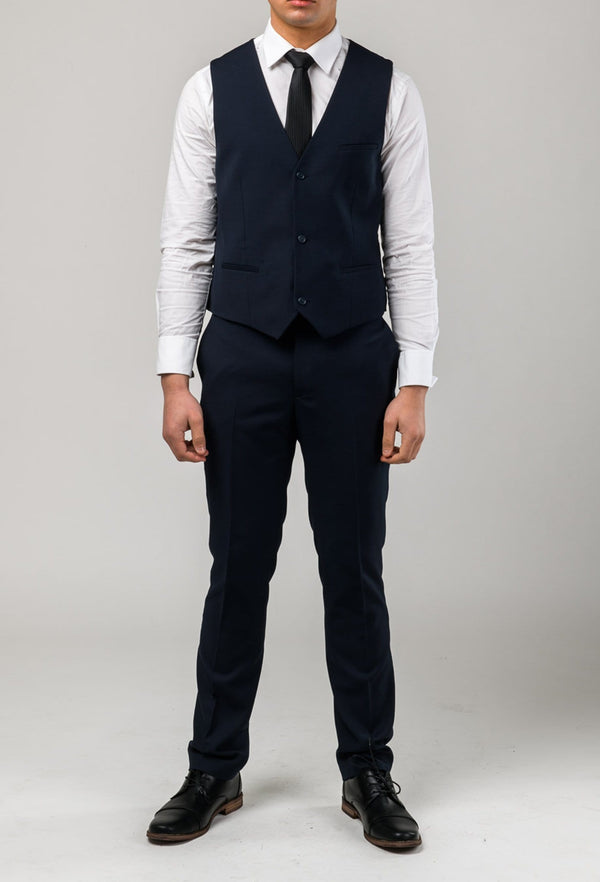 a front on view of the Aston slim fit moores vest in navy A049301V-NL styled with a white shirt and black tie