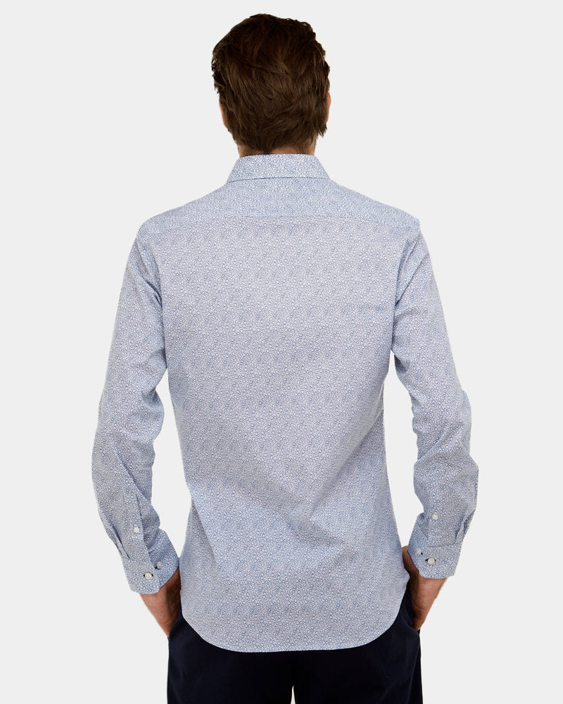 showing the slim fit and button cuff detail of the geo print mens shirt