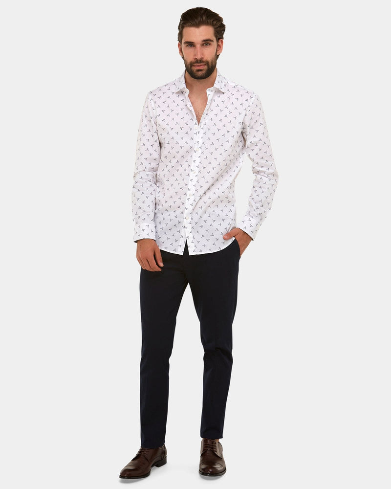 a white mens dress shirt in a classic fit worn with black chino pants