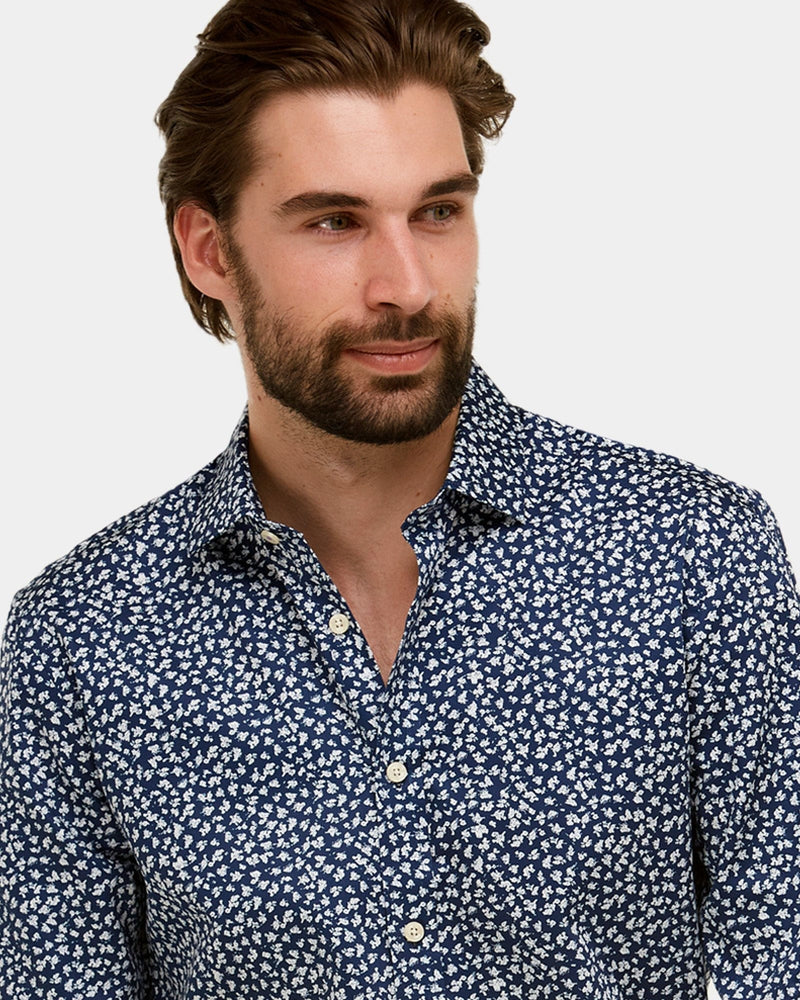 a slim fit navy mens shirt in navy with a small white floral print
