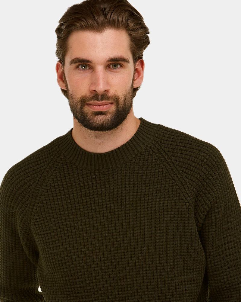 ribbed crew neck design of the mens long sleeve knitted sweater in khaki