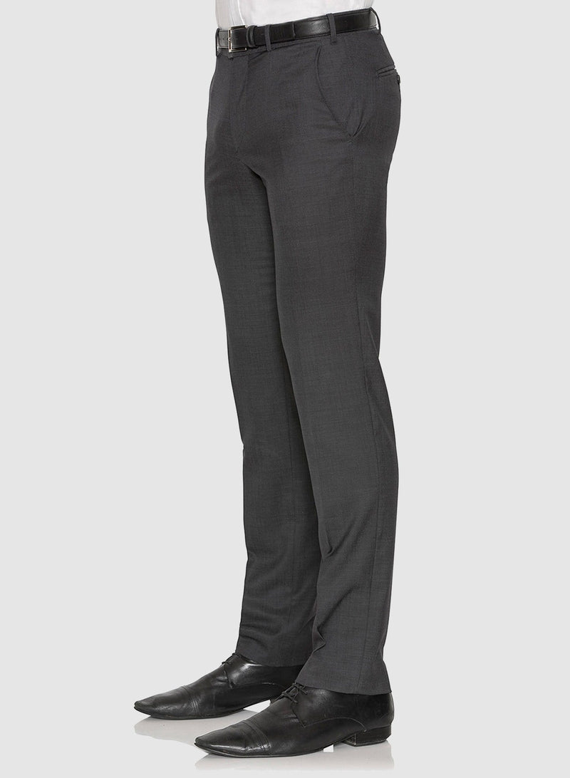 A view of the trousers in the A full view of a model wearing the Cambridge classic fit range suit in charcoal pure wool F2800