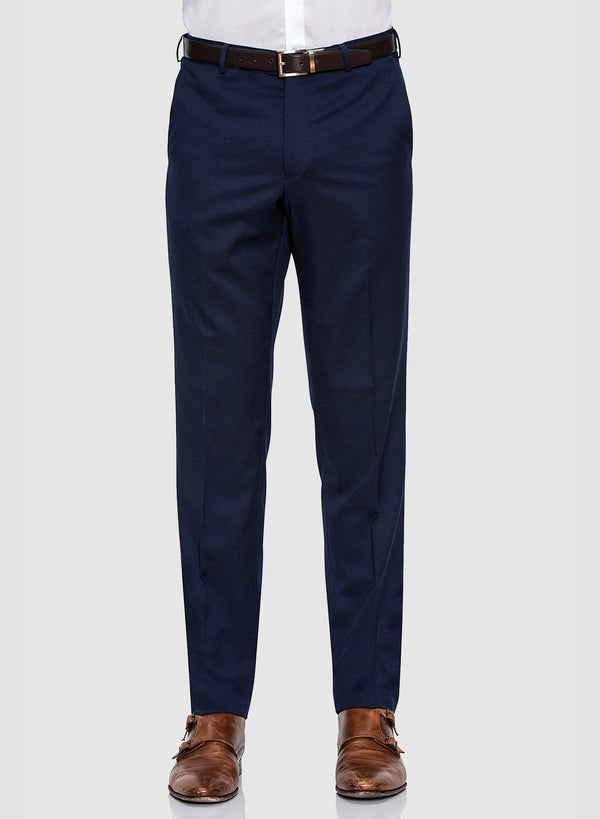 a picture of a model facing forward wearing the Cambridge classic fit interceptor trouser in dark blue navy pure wool F2800