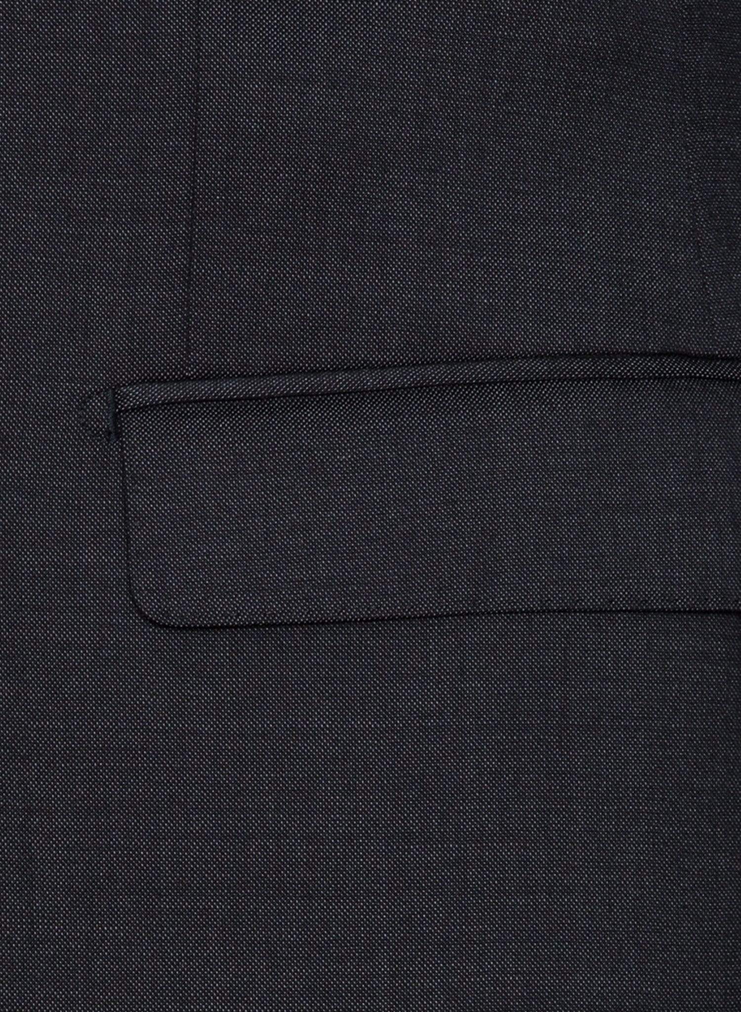 A close up view of the pocket detail on the Cambridge classic fit range suit jacket in charcoal pure wool F2800