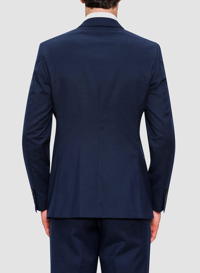 An image of the back of a model wearing a Cambridge classic fit range suit in dark blue navy pure wool F2800