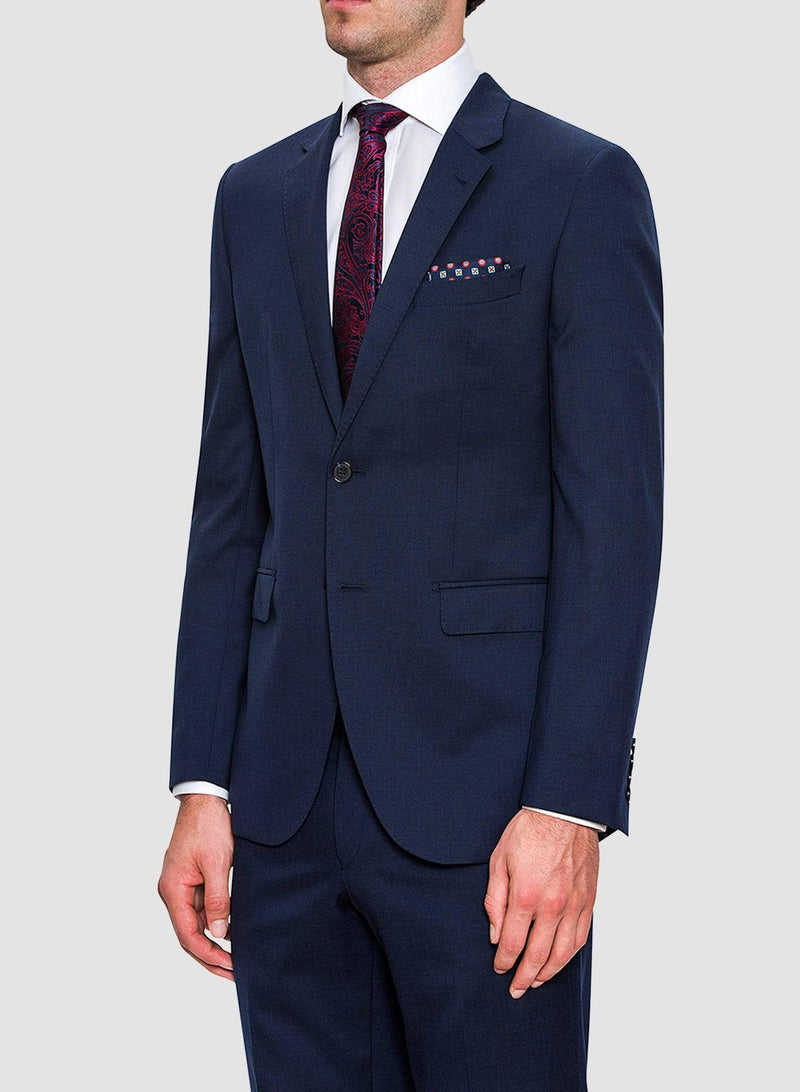 An image of a model wearing a Cambridge classic fit range suit in dark blue navy pure wool F2800