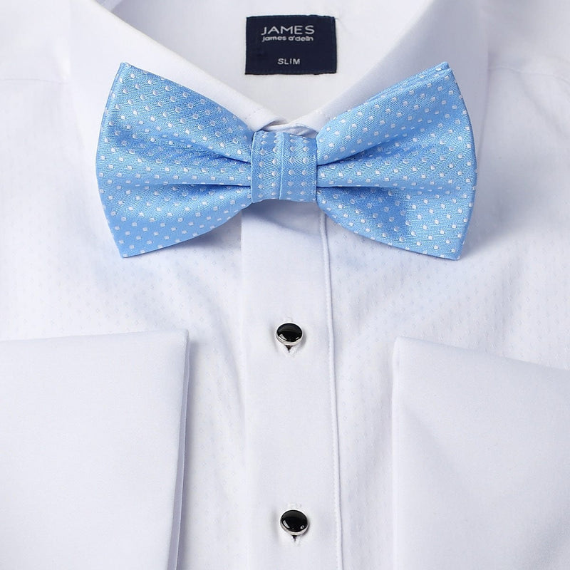 a blue bow tie on a white mens formal shirt