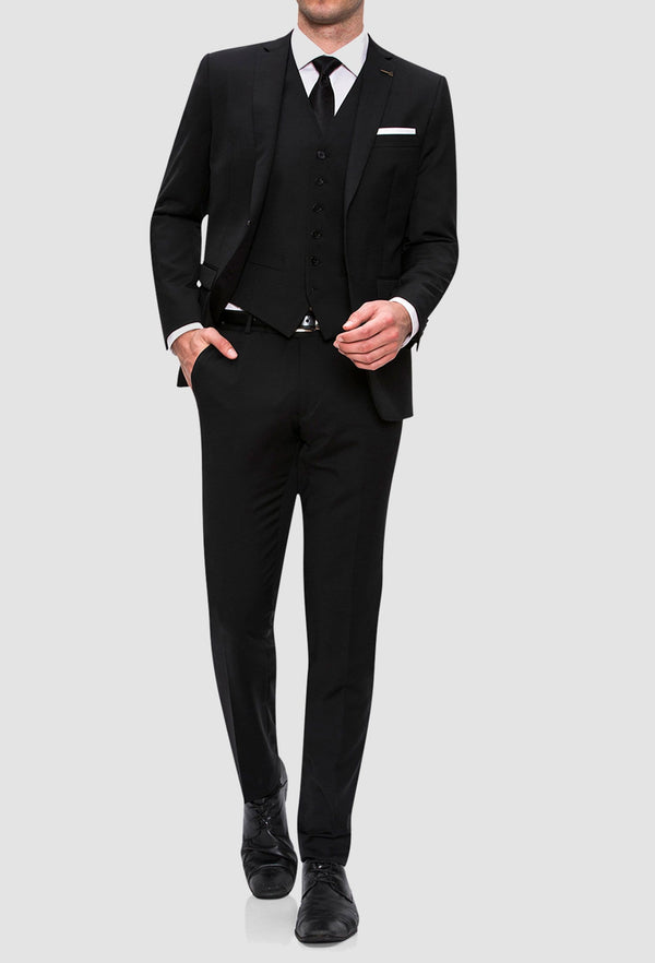 A full length view of the Joe Black slim fit anchor suit in black pure wool FJV032 styled with a white shirt