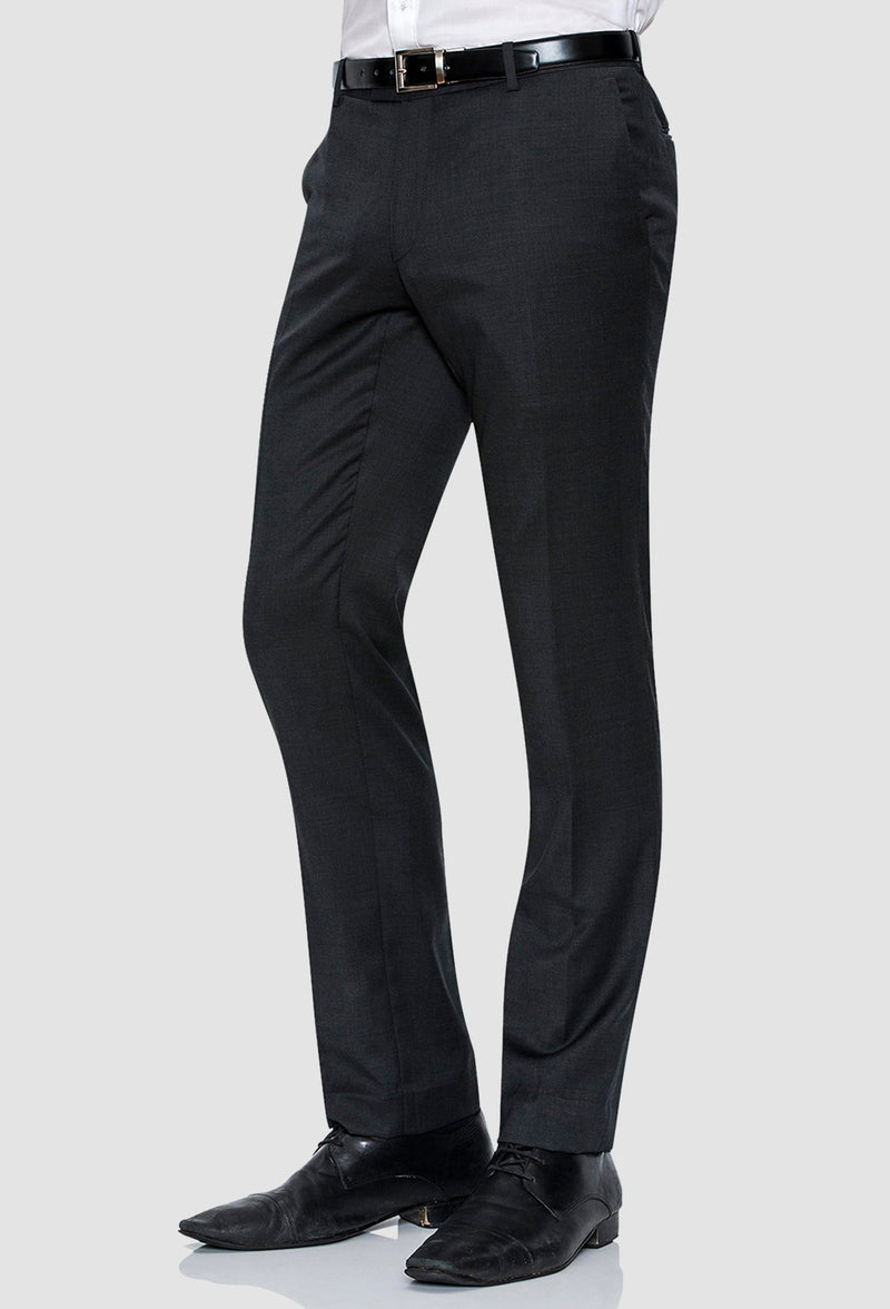 a side on view of the Joe Black slim fit razor trouser in charcoal pure wool with a white shirt and black belt
